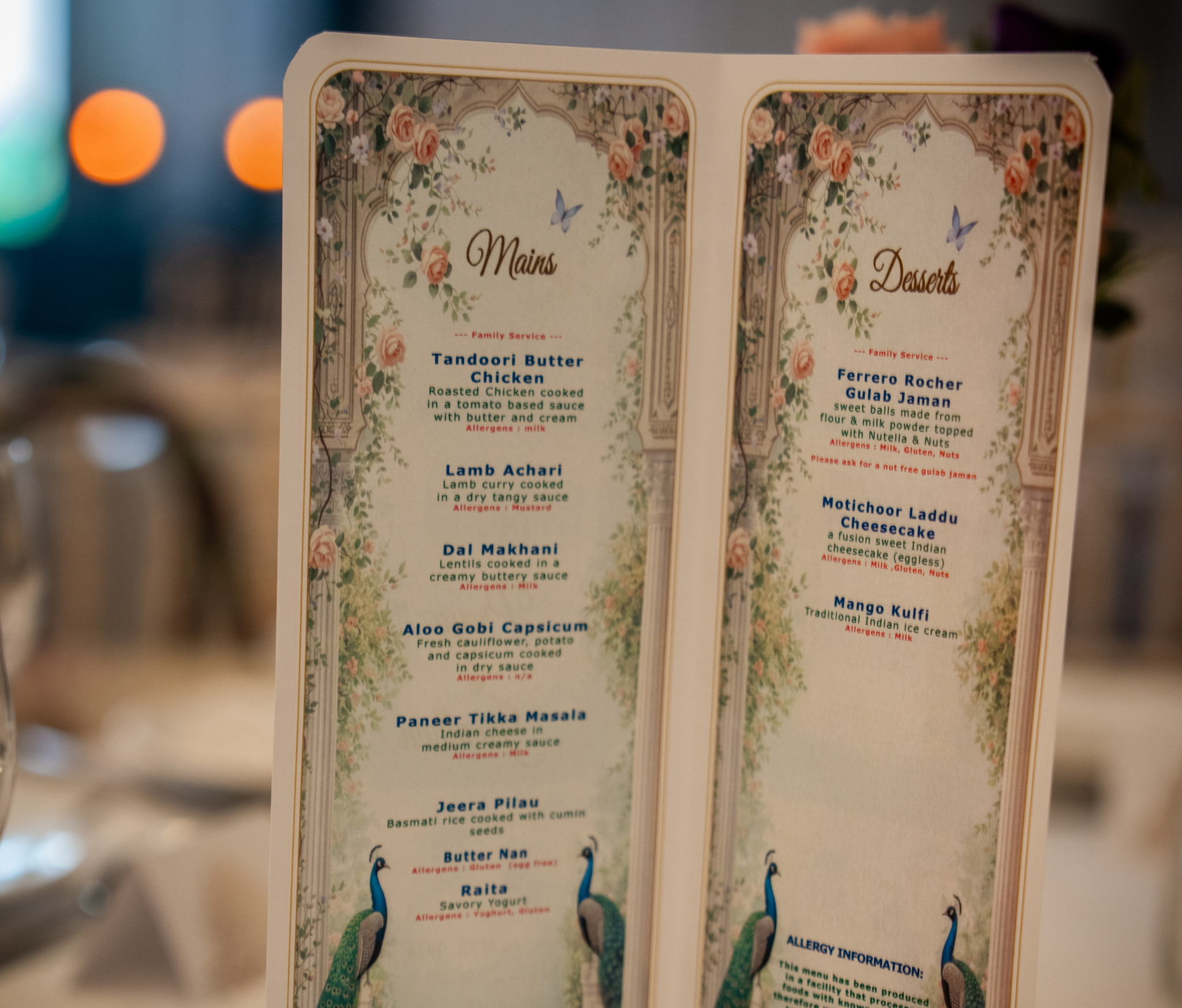 Floral wedding menu card displaying mains and desserts