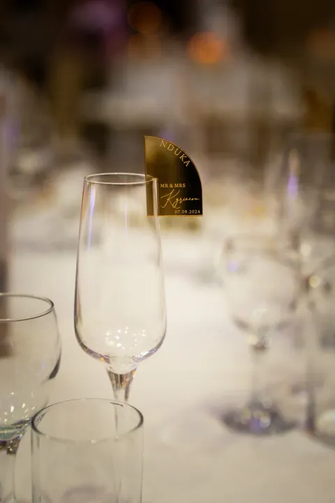 A personalised glass charm at a place setting