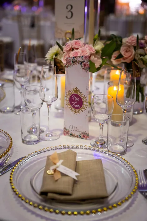 Wedding favour on a gold-edged place setting