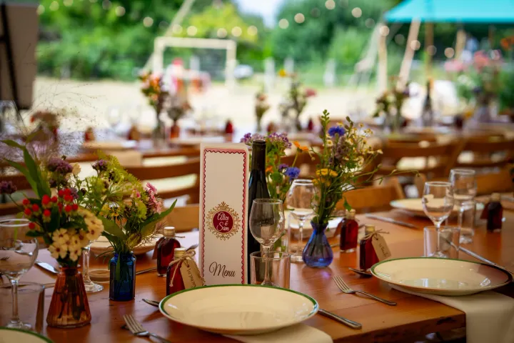 Rustic wedding table with flowers and menu cards