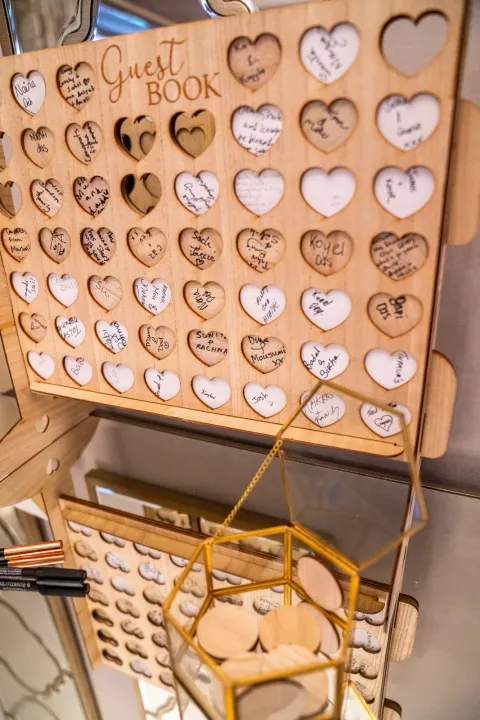 Wooden guest book with heart-shaped messages