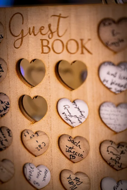 Close view of a wooden heart guest book