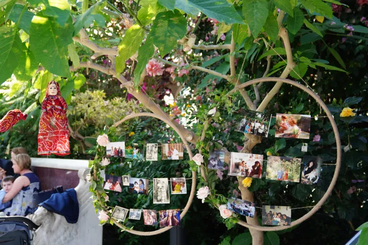 Family photographs displayed on a decorative tree