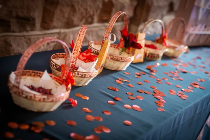 Decorated gift baskets on a petal-strewn table