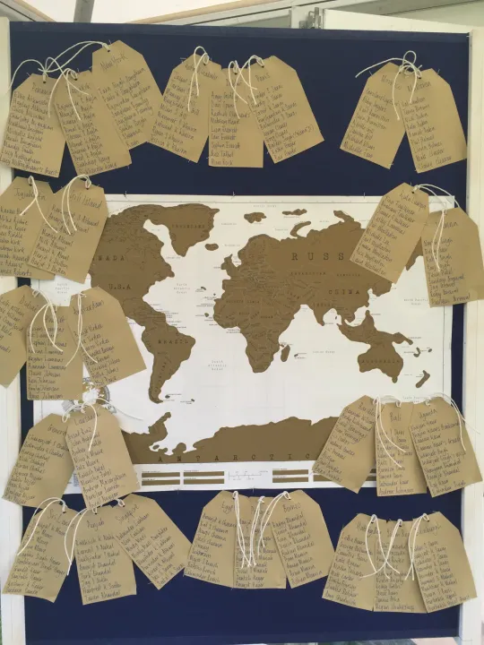 Travel-themed seating plan with a world map