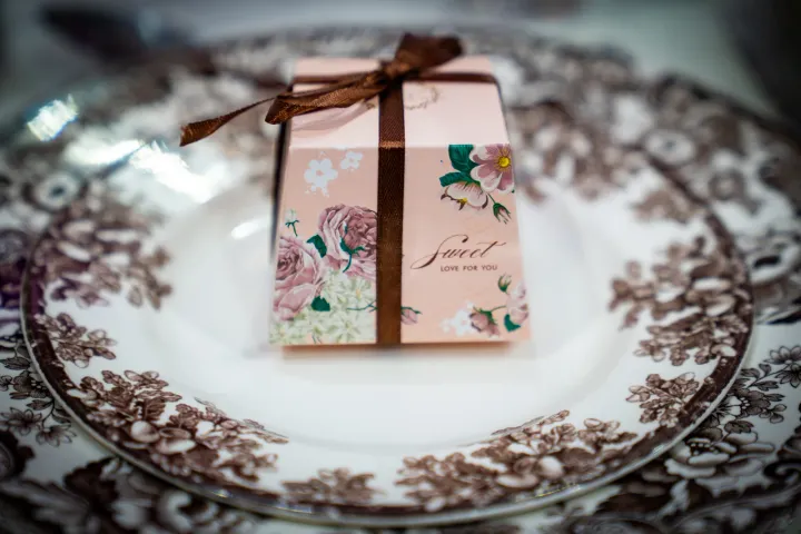 Wedding favour on a floral-patterned plate