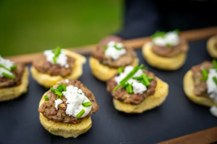 Bite-sized savoury tartlets with fresh garnish