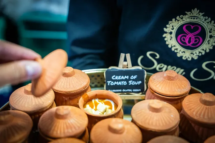 Cream of tomato soup served in small terracotta pots