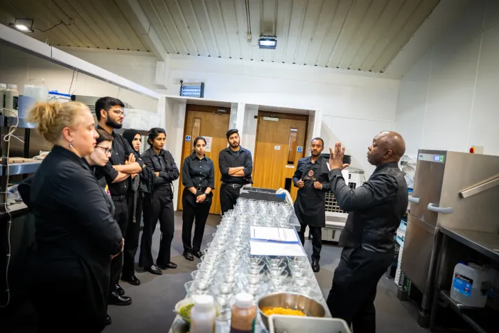 Catering team briefing before service