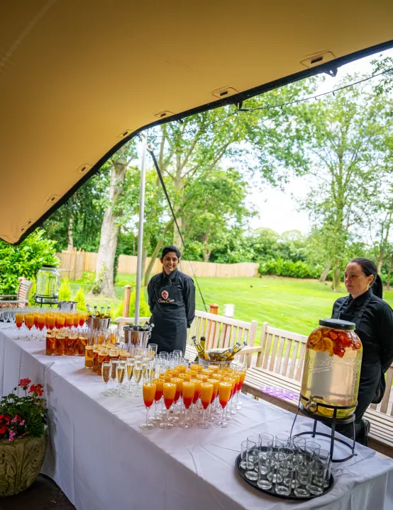 Welcome drinks arranged under an outdoor canopy