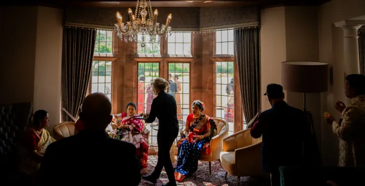 Guests socialising in a warmly lit reception room