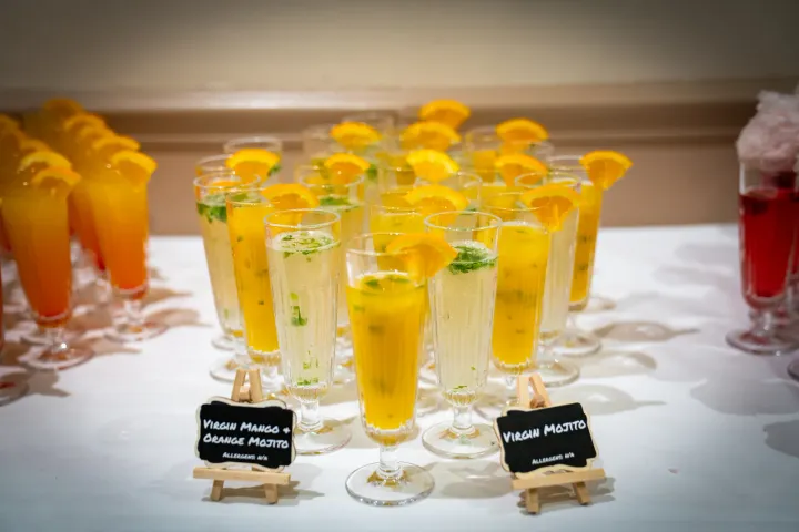Colourful fruit drinks garnished with citrus