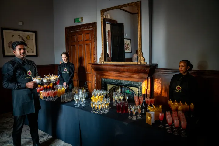 Catering team attending a reception drinks station