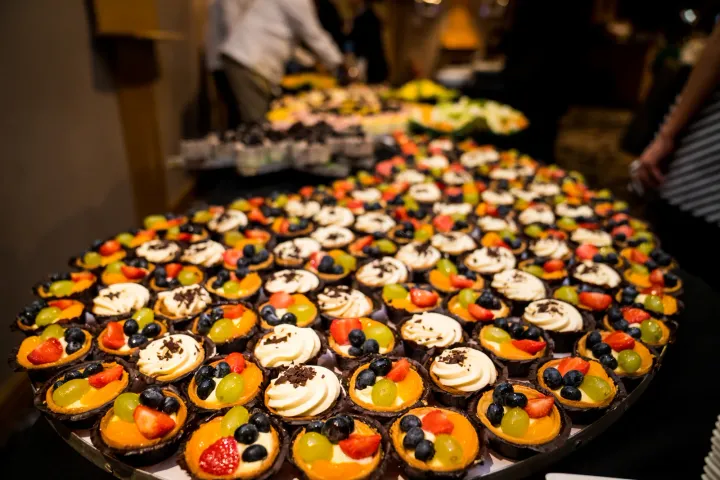 A generous display of fruit and cream tartlets