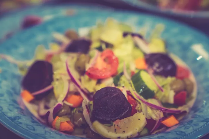 A fresh mixed salad with sliced vegetables