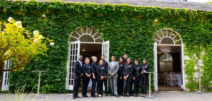 Catering team outside an ivy-covered venue