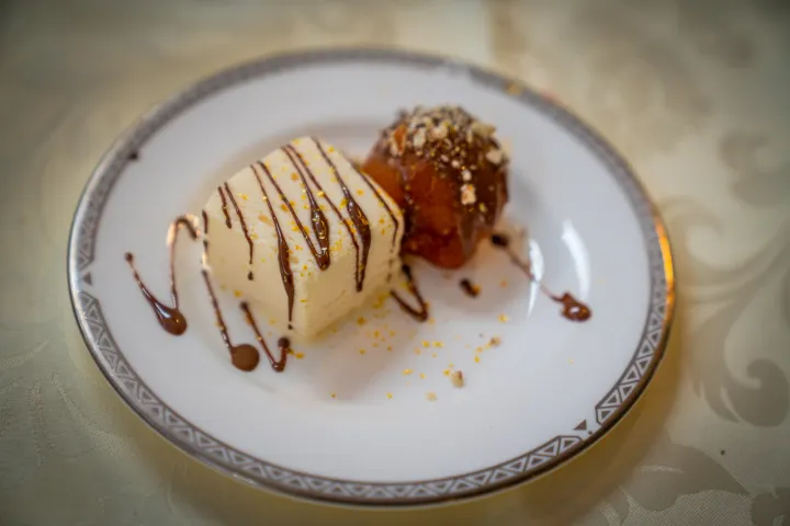 Ice cream and a warm dessert with chocolate sauce