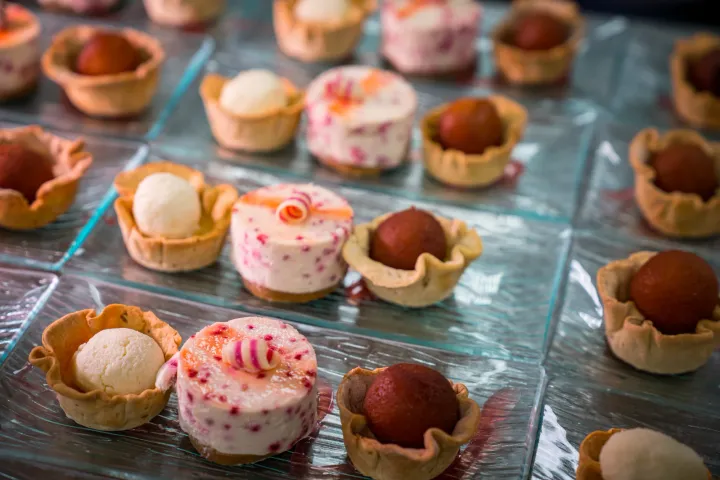 A selection of individual desserts with ice cream