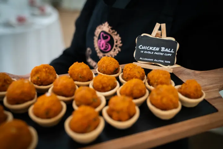 Cheese balls presented on individual tasting spoons