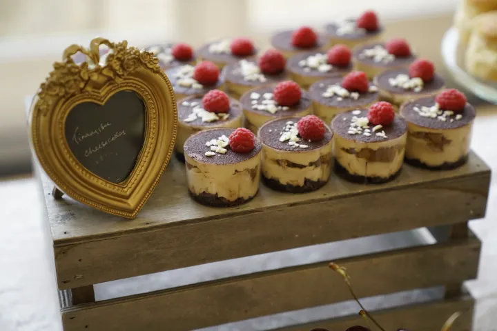 Individual layered desserts topped with strawberries