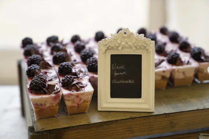 Individual berry desserts on a rustic display