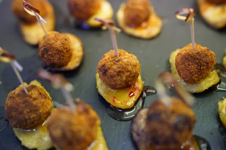 Golden canapé bites with cocktail picks