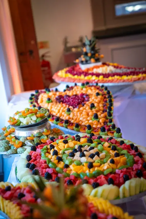 Fresh fruit arranged on an abundant buffet display