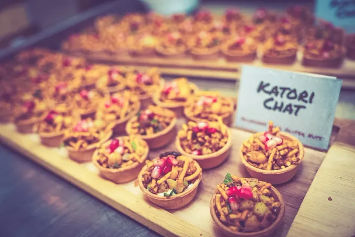 Katori chaat arranged on a wooden tray