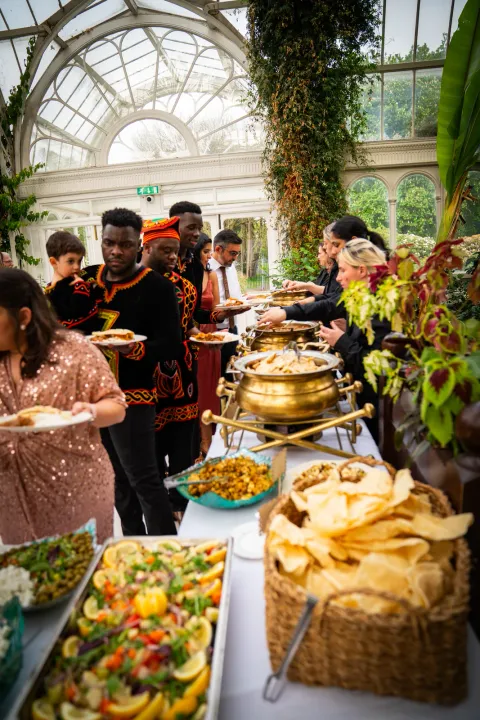 Guests choosing dishes from a glasshouse buffet