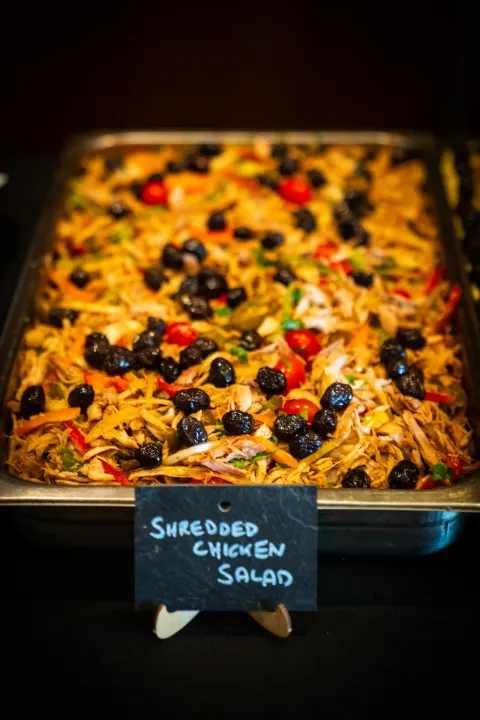 Shredded chicken salad ready for buffet service
