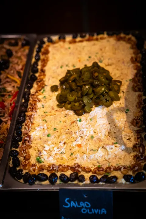 A dressed salad in a rectangular serving dish