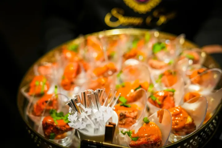 Savoury bites and dips presented in individual glasses