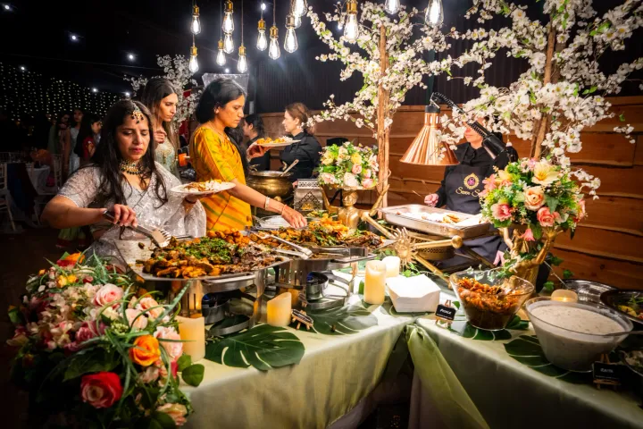 Guests choosing dishes from a decorated buffet
