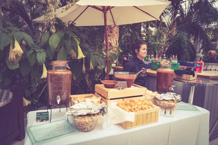 A drinks and snack station among tropical plants