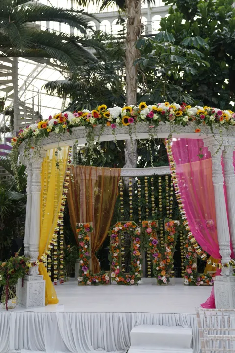 Colourful ceremony draping among tropical plants
