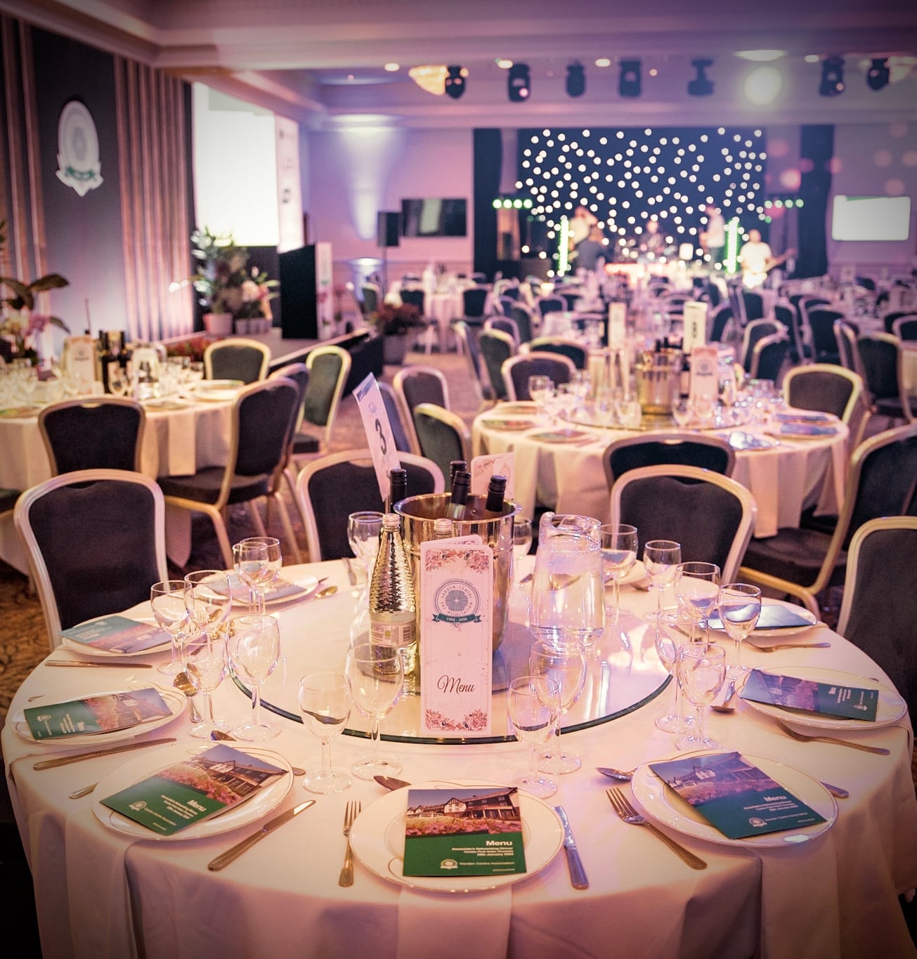 An elegant dining room prepared for a corporate event