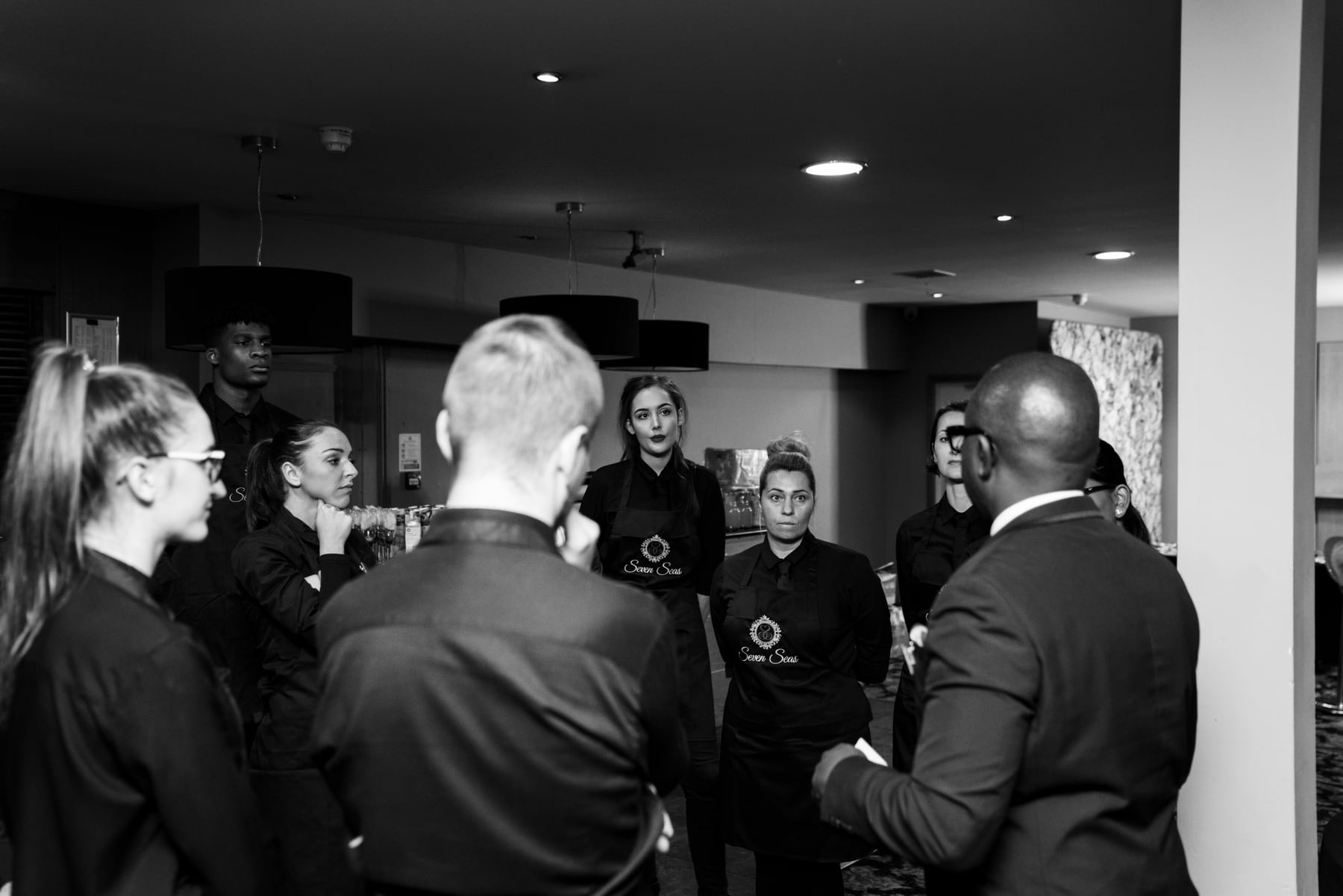 The Seven Seas service team receiving an event briefing