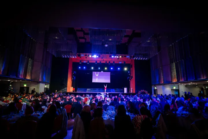 An evening celebration with a brightly lit stage