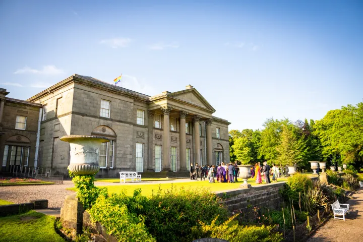 Stately house terrace overlooking landscaped gardens