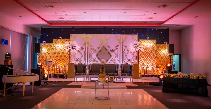 Ornate wedding seating on a decorated stage
