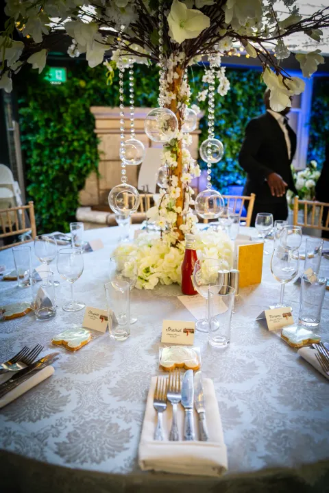 Dressed table with candles and botanical details
