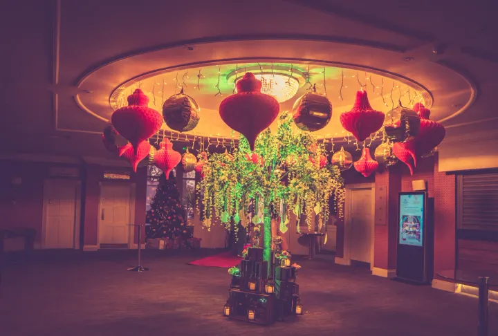 Decorative lantern installation with trailing greenery