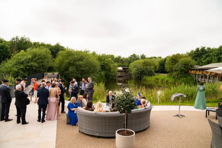 Outdoor reception beside a planted circular terrace