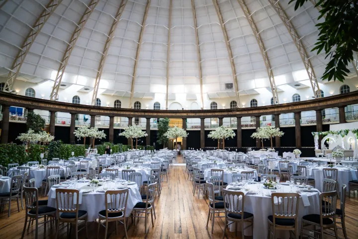 Round tables arranged beneath a domed ceiling