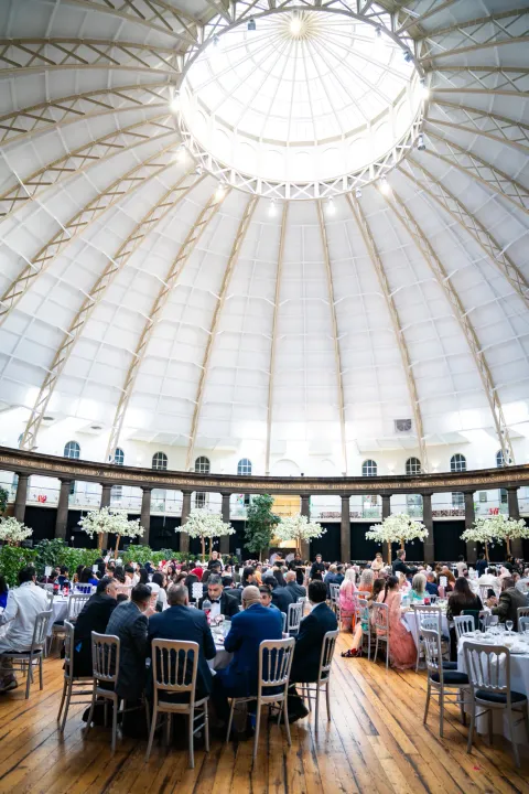 Guests dining in a bright domed venue