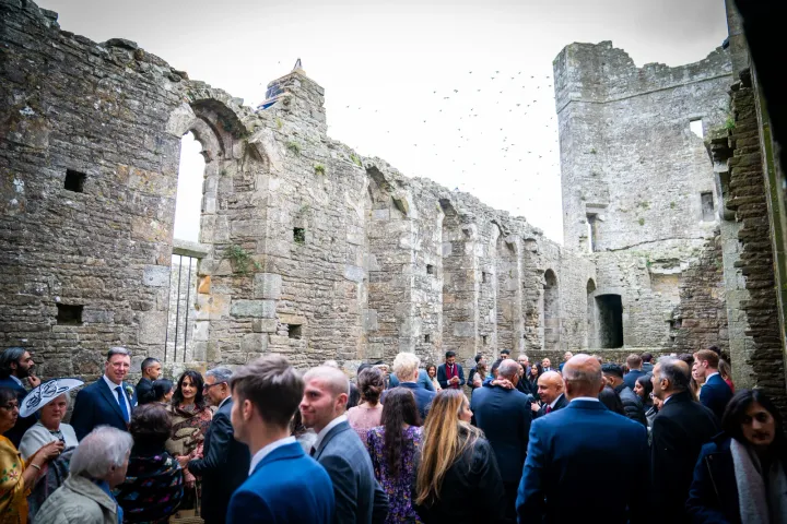 Guests gathered among historic castle ruins