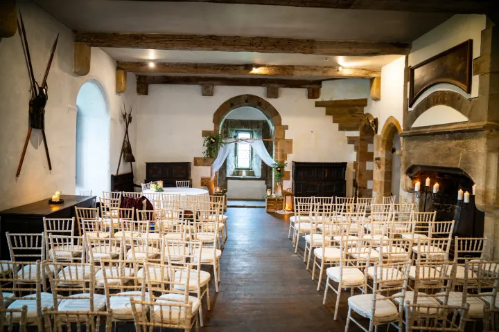 Ceremony seating in a stone and timber room