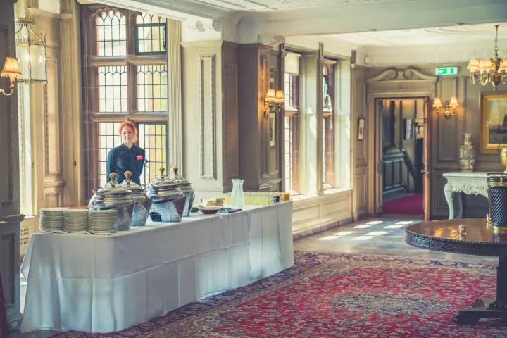 Reception drinks arranged beside tall windows