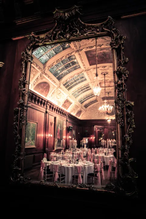 An ornate doorway framing reception tables