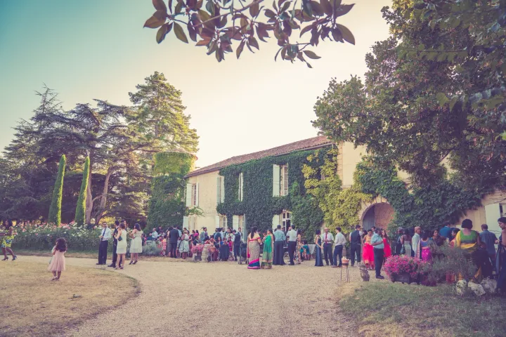 Guests gathered beside an ivy-covered venue